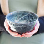 person holding empty bowl
